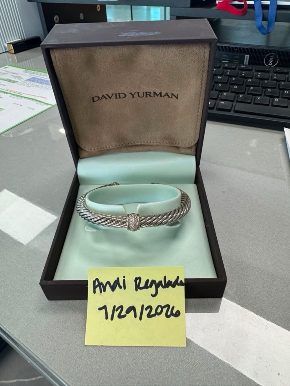 David Yurman Sterling Silver Cable Bracelet with Pink Paper Background